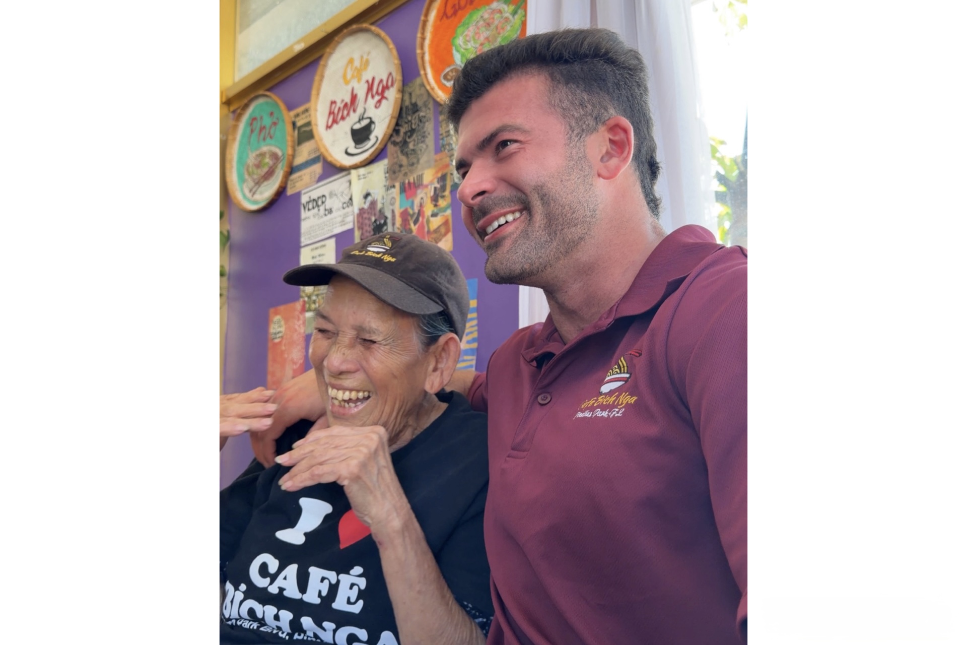 A women and man smiling and laughing.